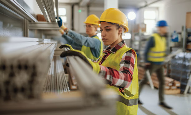 Industry employees working in metal industry with alloy profiles.